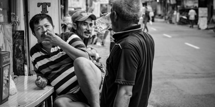 Local people. talking and drink a coffe, tea and juice beside the street Girilaya. Dolly is the alley name in Girilaya street and Jarak Putat Jaya street Surabaya. In the past Dolly area are very famoust because this place is the biggest prostitution business in South East Asia .Until finaly June 2014 the local government wiped out and close all prostitution business in this area. Since June 2014, a government provide are peoples in this area. Help them make a new job and new business.