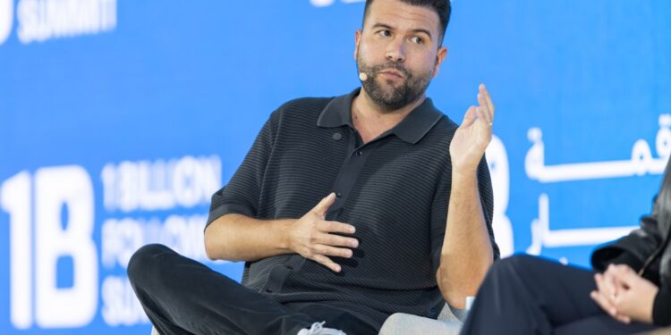 Carlos Gil, author and keynote speaker, speaking on stage at the 1 Billion Followers Summit in Dubai. The session focused on personal branding, social media strategy, and building scalable creator-led businesses through owned audiences and real-world monetization.