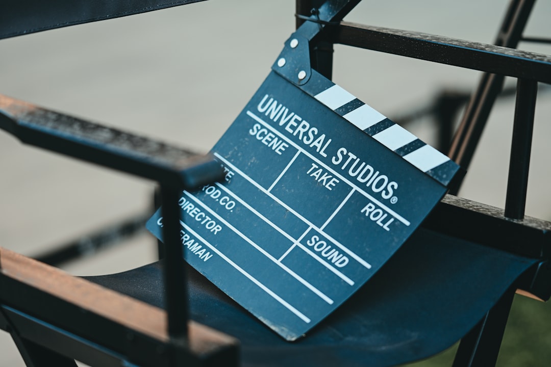 A clapperboard rests on a director's chair.