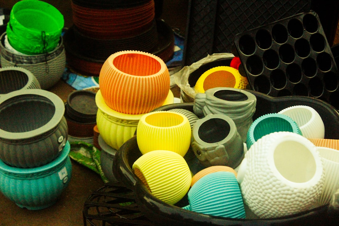 Assortment of colorful plant pots and seedling trays