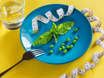 Diet blue plate with centimeter peas and basil